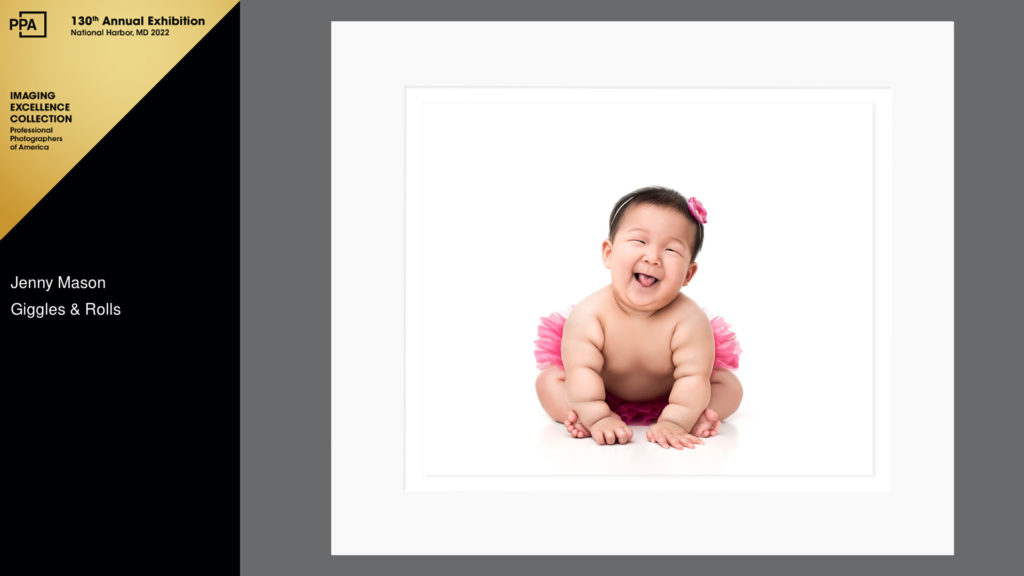 laughing asian baby with rolls in pink tutu award winning photo