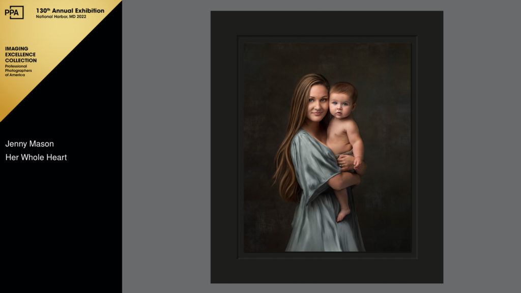 mother in blue dress with baby award winning diamond photographer
